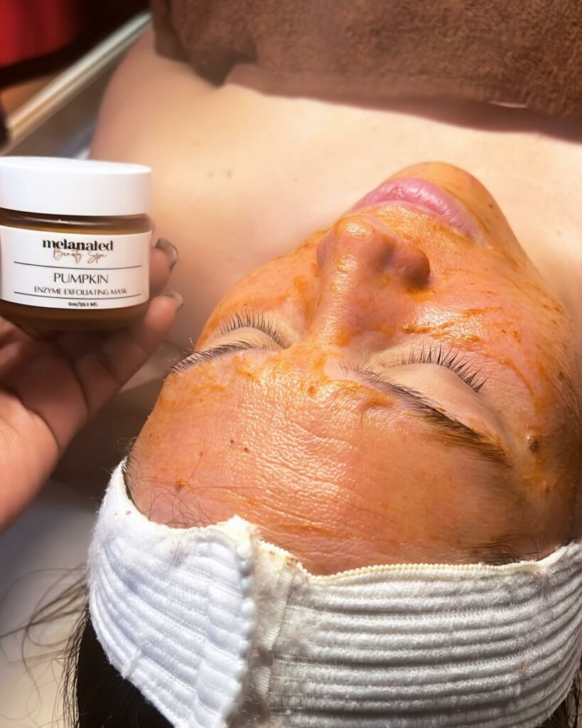 woman gets a pumpkin scrub at melanated beauty spa