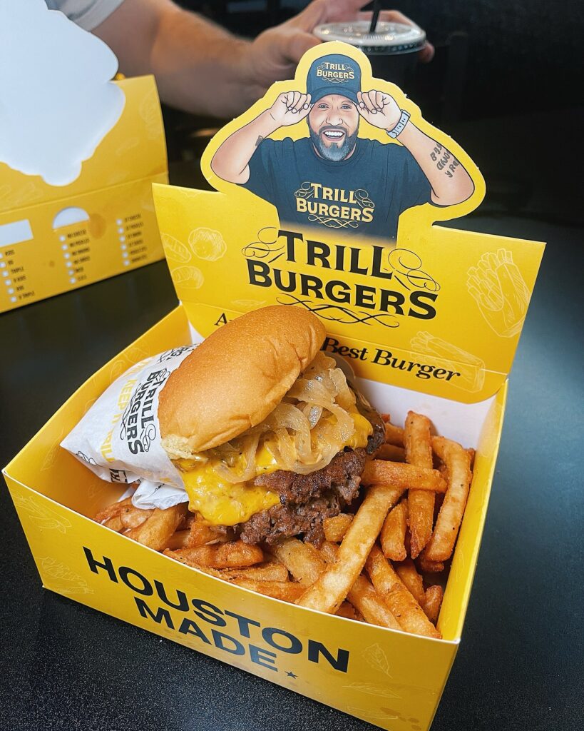 An Original Trill Burger and Fries in a signature container