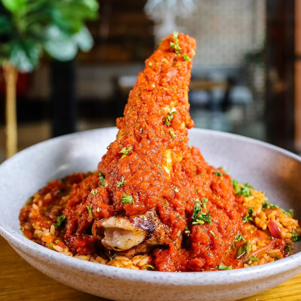 Obe Ata Braised Lamb Shank with Jollof Rice from Farm and Oak in Richmond, Virginia