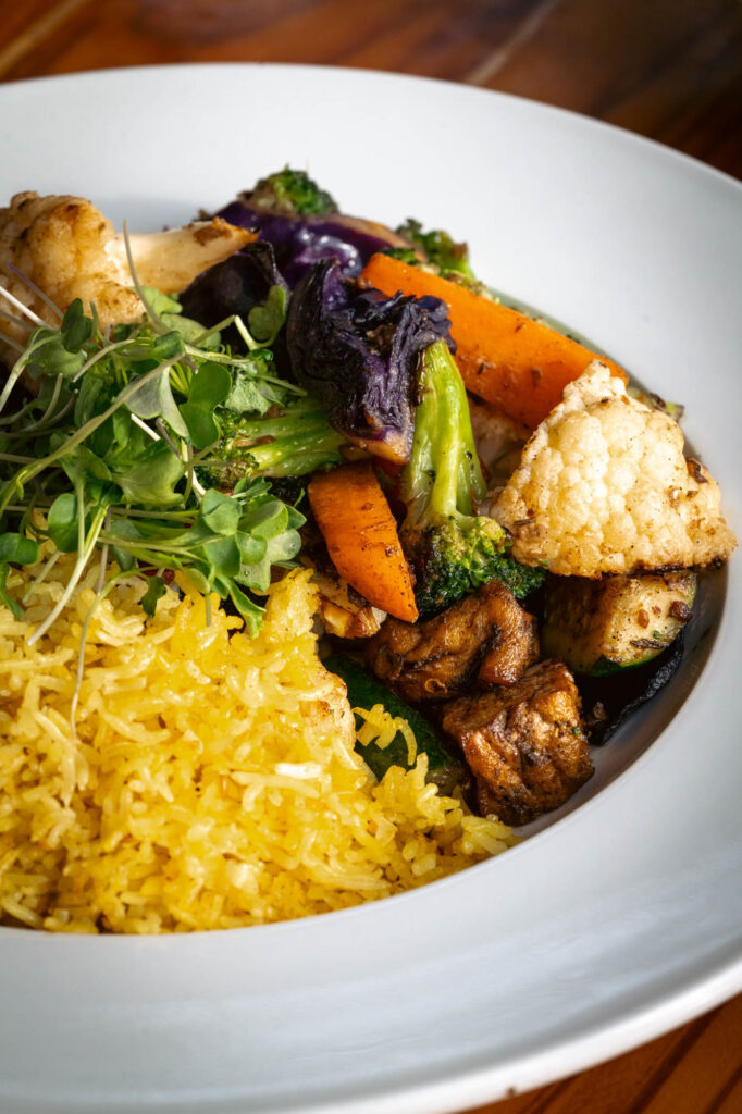 Bowl of roasted vegetables and rice from Majani Soulful Vegan Cuisine